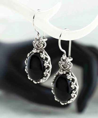 Filigree art black onyx gemstone crown silver oval drop earrings for women, featuring intricate jewelry design