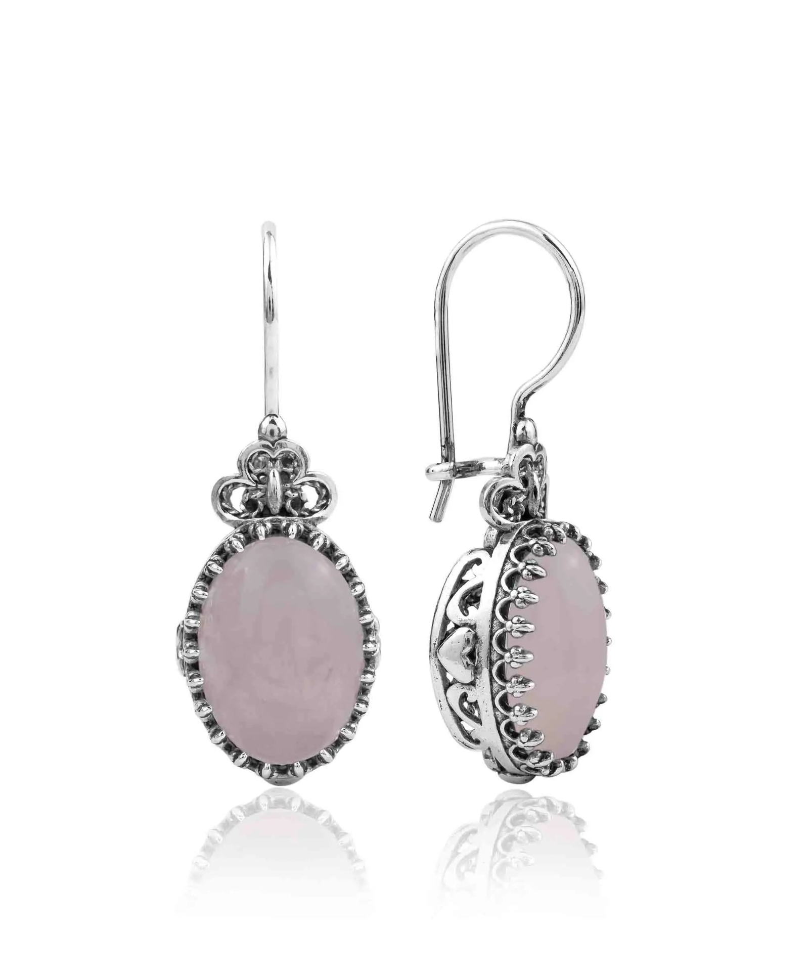 Silver oval drop earrings with filigree design and rose quartz gemstone hearts, detailed jewelry for women.