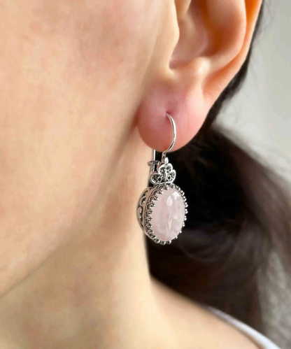 Silver oval drop earrings with filigree designs and rose quartz gemstone hearts, detailed women’s jewelry by Start2Finish.