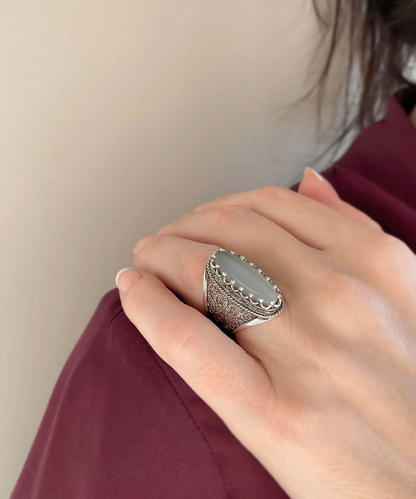 Gray moonstone gemstone women’s silver long statement ring with intricate filigree art design, jewelry piece by Start2Finish.
