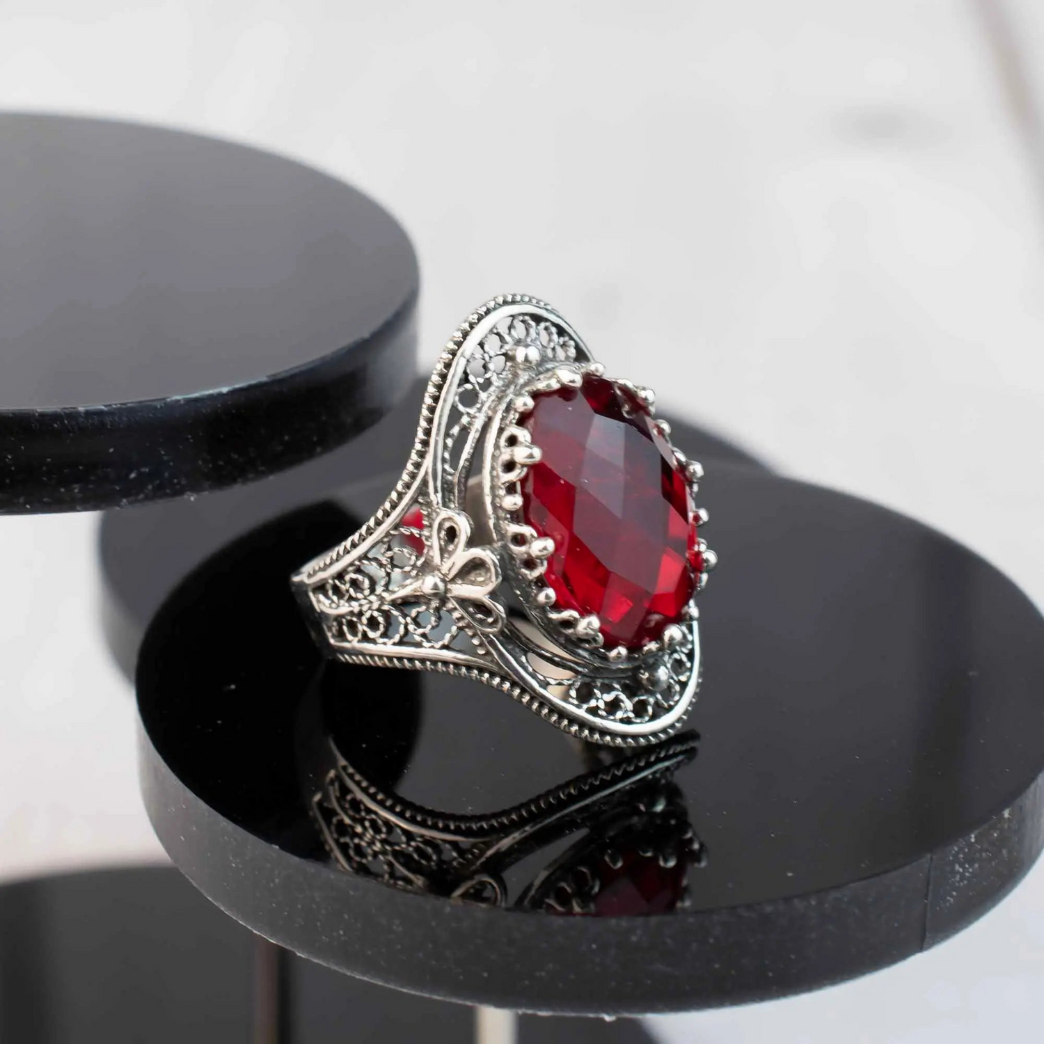 Silver statement ring featuring a Ruby Quartz gemstone with intricate filigree design, designed for women.