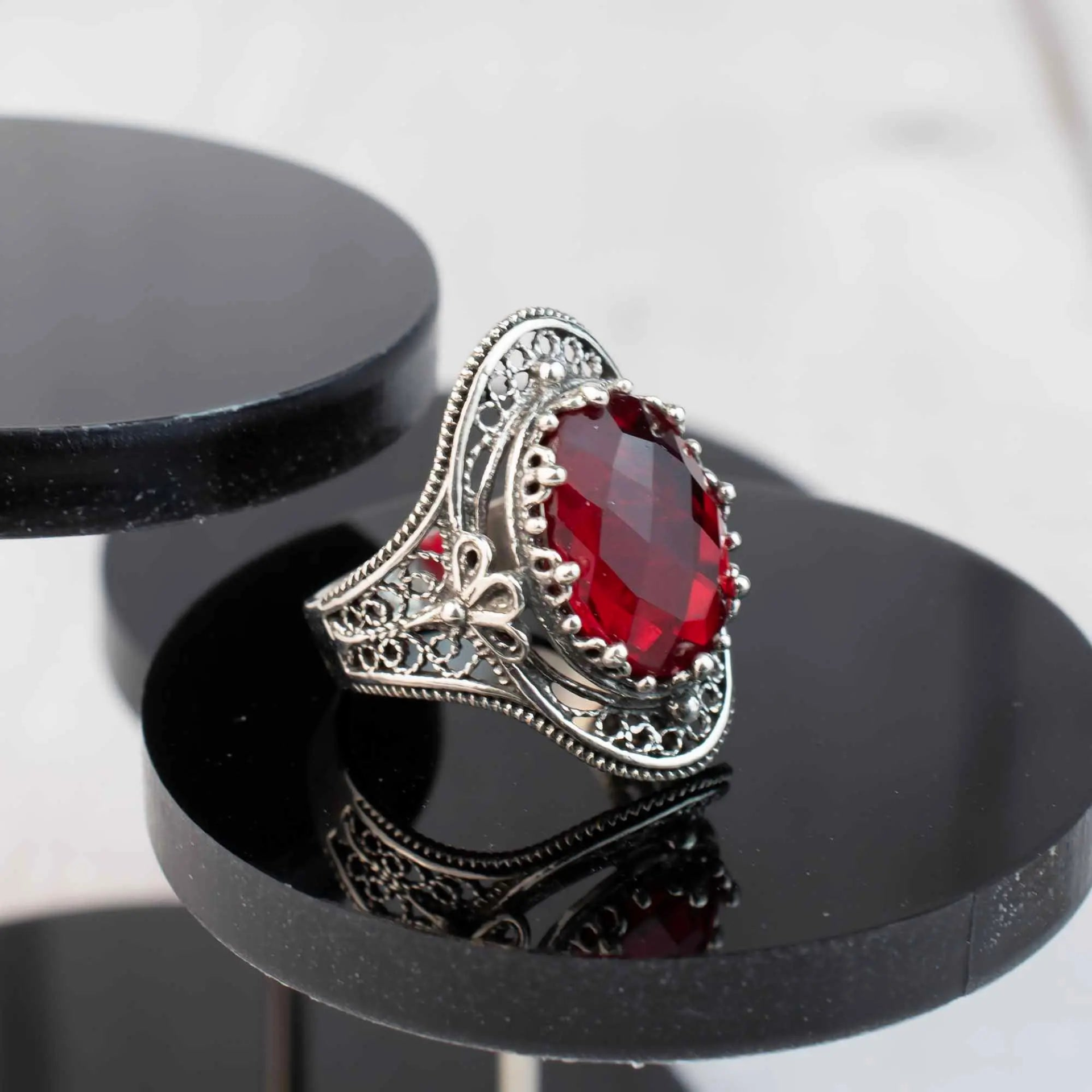 Silver statement ring featuring a Ruby Quartz gemstone with intricate filigree design, designed for women.