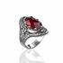 Ruby quartz gemstone filigree art woman silver statement ring with intricate detailing and elegant design.
