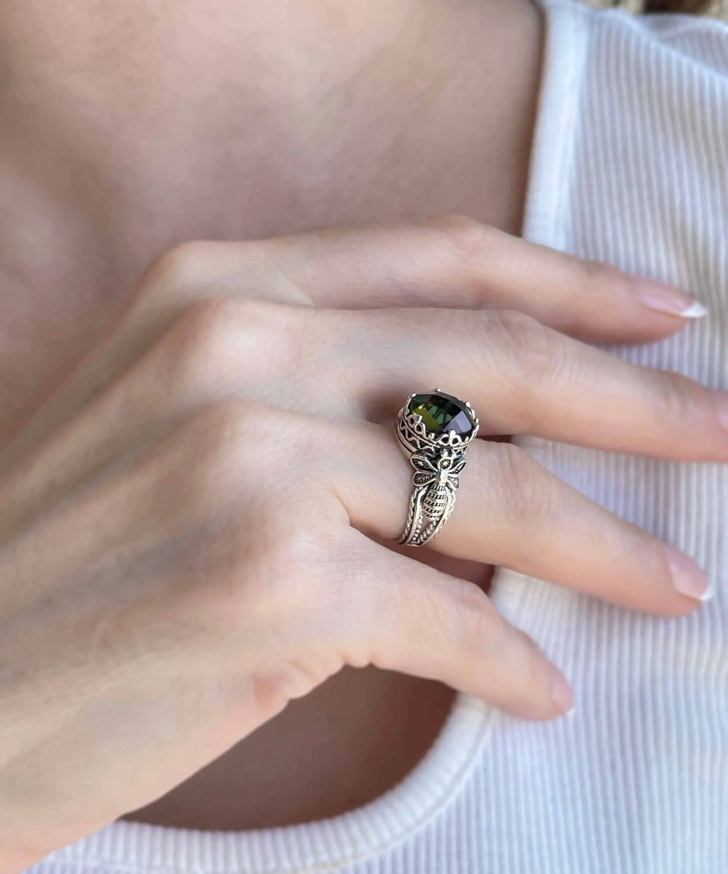 Silver cocktail ring featuring a detailed alexandrite gemstone with intricate filigree art design for women.