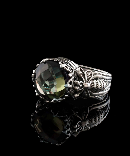 Silver cocktail ring featuring detailed alexandrite gemstone and filigree art design for women.