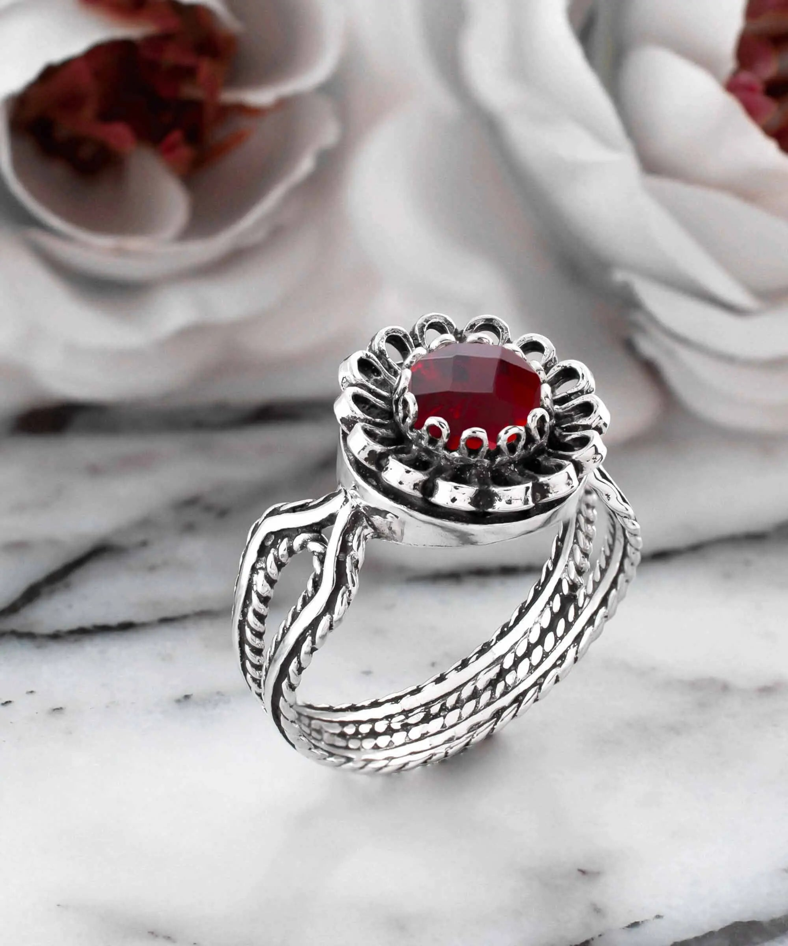 Ruby quartz gemstone sterling silver cocktail ring for women featuring a vibrant red gemstone set in a silver band.