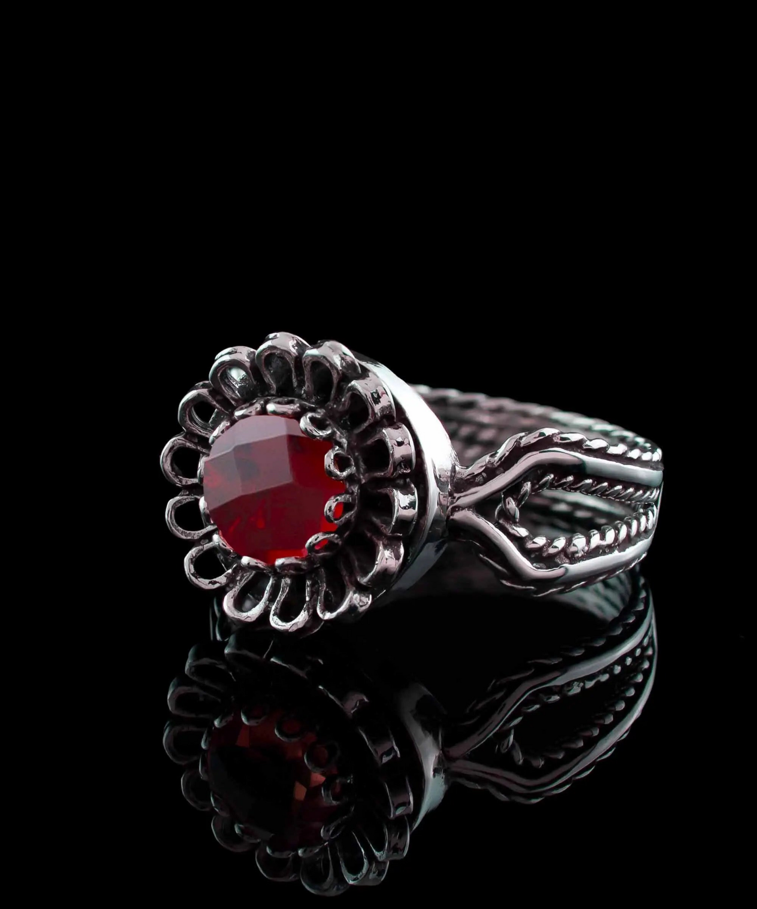 Ruby quartz gemstone sterling silver women’s cocktail ring with a bold, faceted red stone and intricate silver band design.