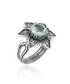Silver cocktail ring featuring a filigree art prasiolite gemstone daisy flower design for women.