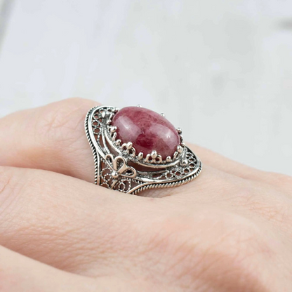 Silver statement ring featuring Rhodonite gemstone and intricate filigree art design, designed for women.