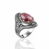 Silver statement ring featuring a rhodonite gemstone with intricate filigree details and an elegant woman motif.