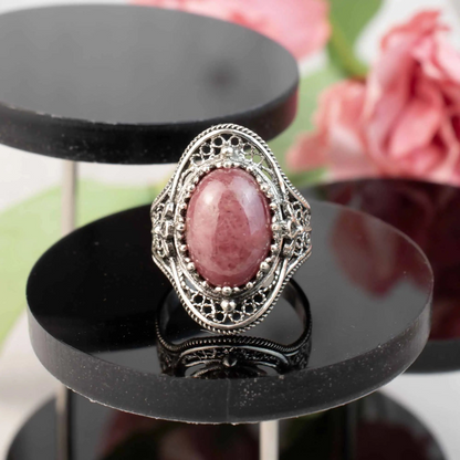 Silver statement ring with intricate filigree detailing and a central Rhodonite gemstone, designed for women.