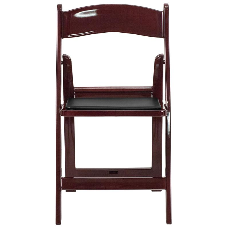 Two red mahogany resin folding chairs with black vinyl padded seats, 1000 lb. capacity, from HERCULES Series by Start2Finish.