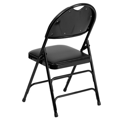 Two black vinyl folding chairs with triple-braced metal frames and easy-carry handles, designed for durable, portable furniture.