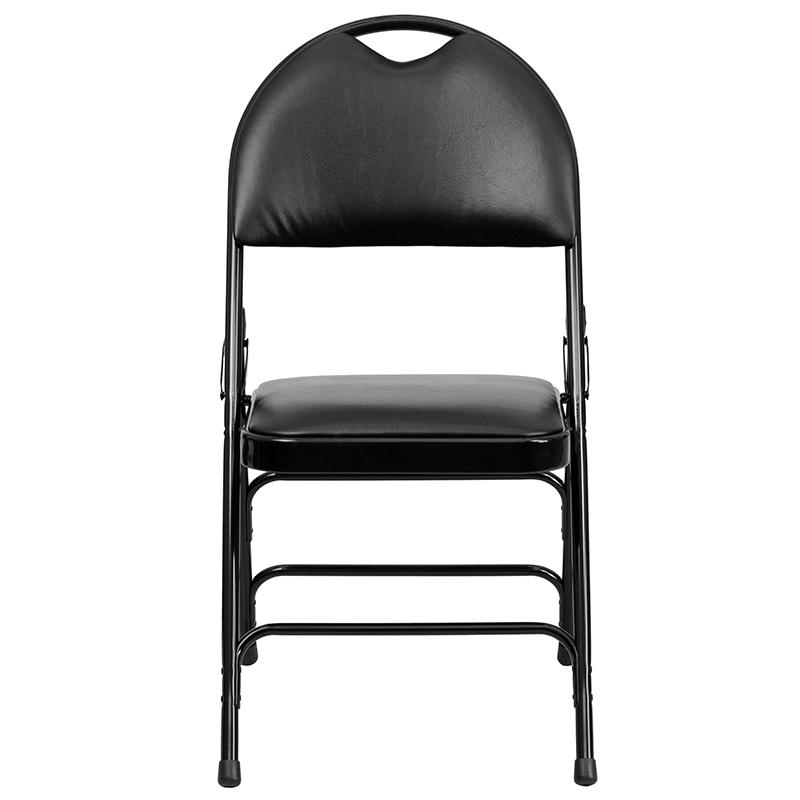 Two black HERCULES Series foldable vinyl metal chairs with triple bracing and easy-carry handles, ideal for versatile furniture use.