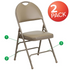 Two beige HERCULES Series vinyl metal folding chairs with triple bracing and easy-carry handles, ideal for versatile furniture use.