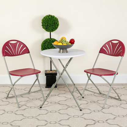Two burgundy HERCULES Series plastic folding chairs with fan back design, 650 lb. capacity, from Start2Finish.