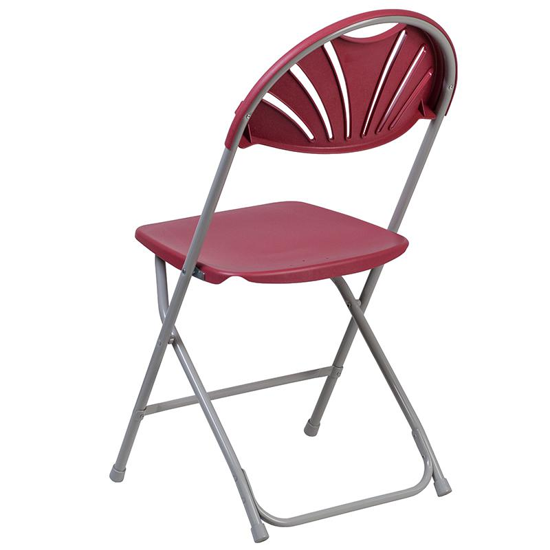 Two burgundy plastic folding chairs with fan back design, 650 lb. capacity, from the HERCULES Series by Start2Finish.