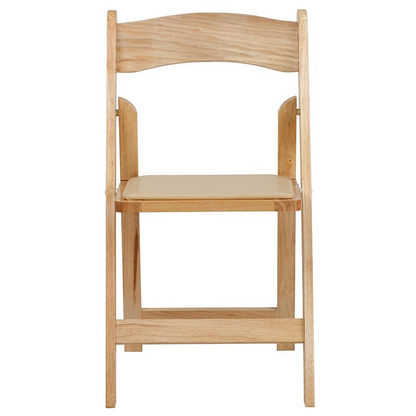 Two HERCULES Series natural wood folding chairs with vinyl padded seats, ideal for versatile indoor and outdoor seating.