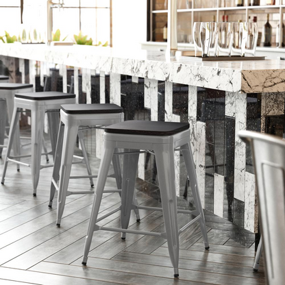 Set of four Start2Finish silver metal counter height stools with gray all-weather poly resin seats, high backless design, indoor use