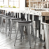 Set of four Start2Finish silver metal counter height stools with gray all-weather poly resin seats, high backless design, indoor use