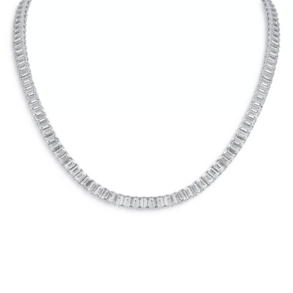 18-inch emerald-cut created moissanite tennis necklace in 14K gold overlay with 30 carats total weight, displayed on a jewelry stand.