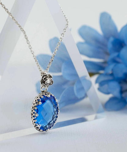 Silver filigree oval pendant necklace featuring a blue quartz gemstone, designed for women, by Start2Finish jewelry.