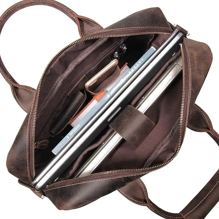 Vintage leather messenger bag from Start2Finish, The Welch Briefcase, with adjustable strap and classic accessory design.