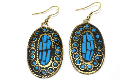 Silver Hestia mosaic oval earrings featuring intricate geometric patterns and a polished silver finish.