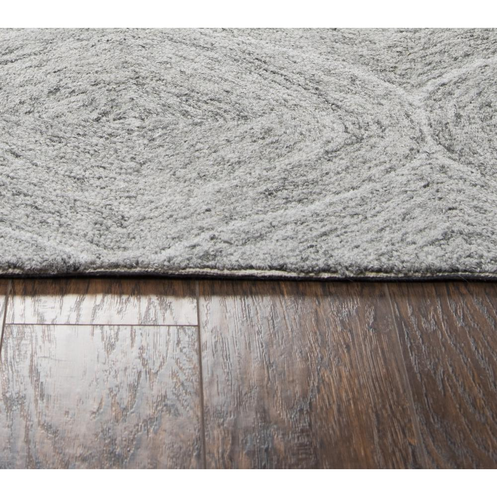 Hand tufted wool rug with loop pile in 5&