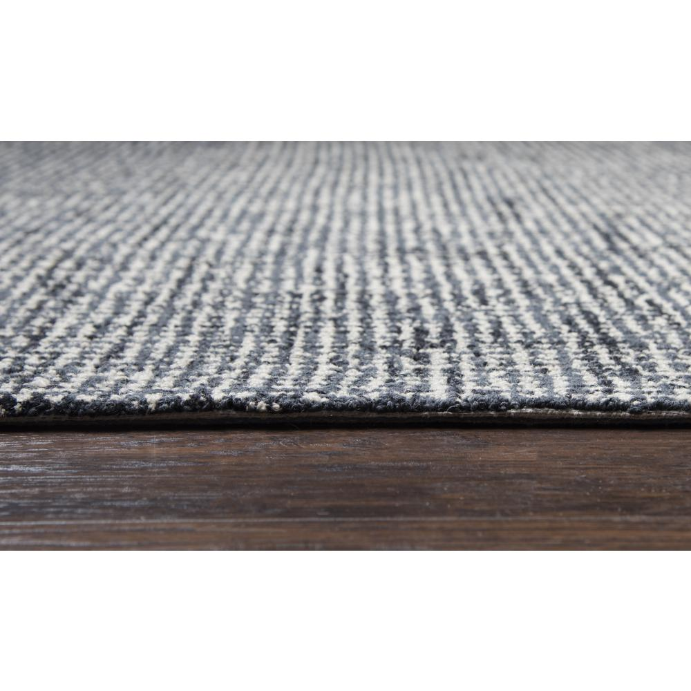 Hand tufted wool rug with loop pile in 5x8 size, featuring neutral tones and textured surface by Start2Finish.