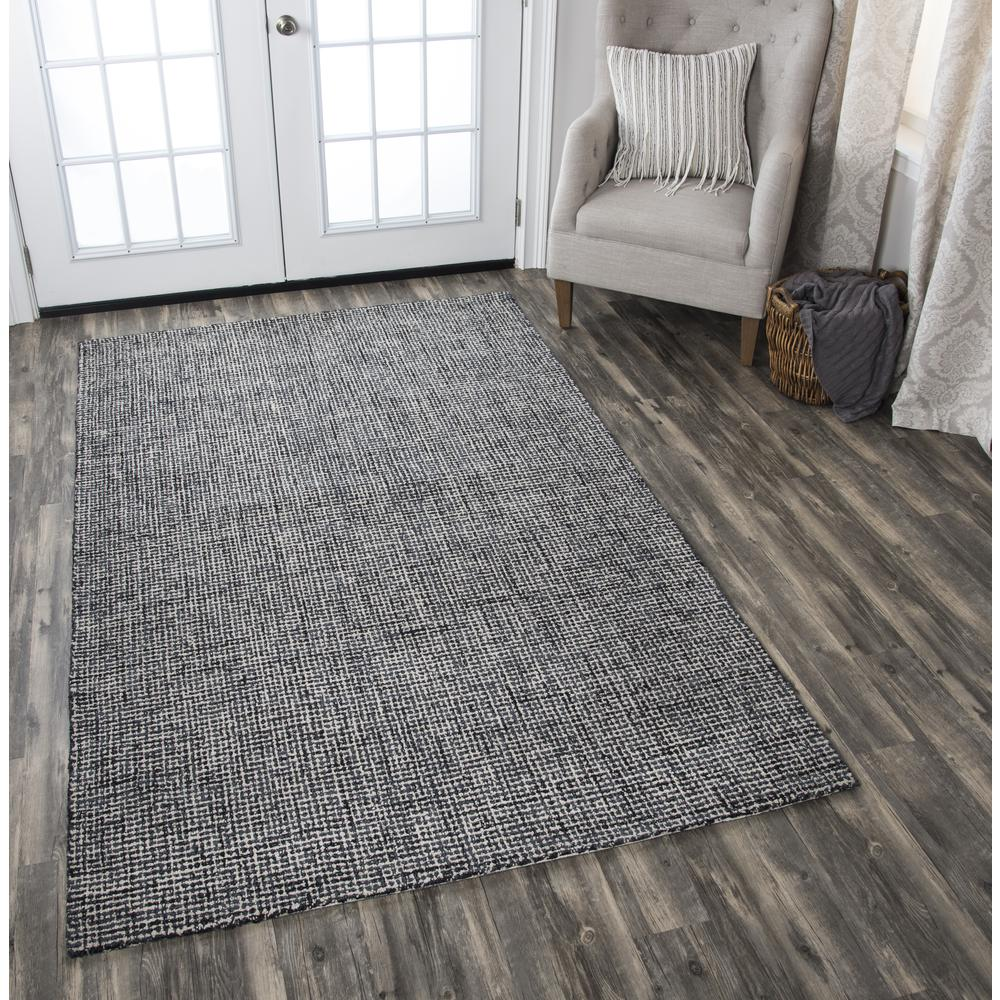 Hand tufted wool rug with loop pile, 5x8 feet, by Start2Finish, showcasing its textured surface and neutral color.