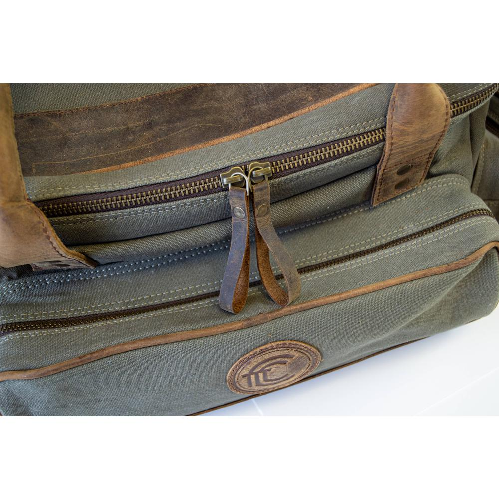 Start2Finish canvas and leather field range bag with multiple compartments and adjustable strap, designed for outdoor accessories.