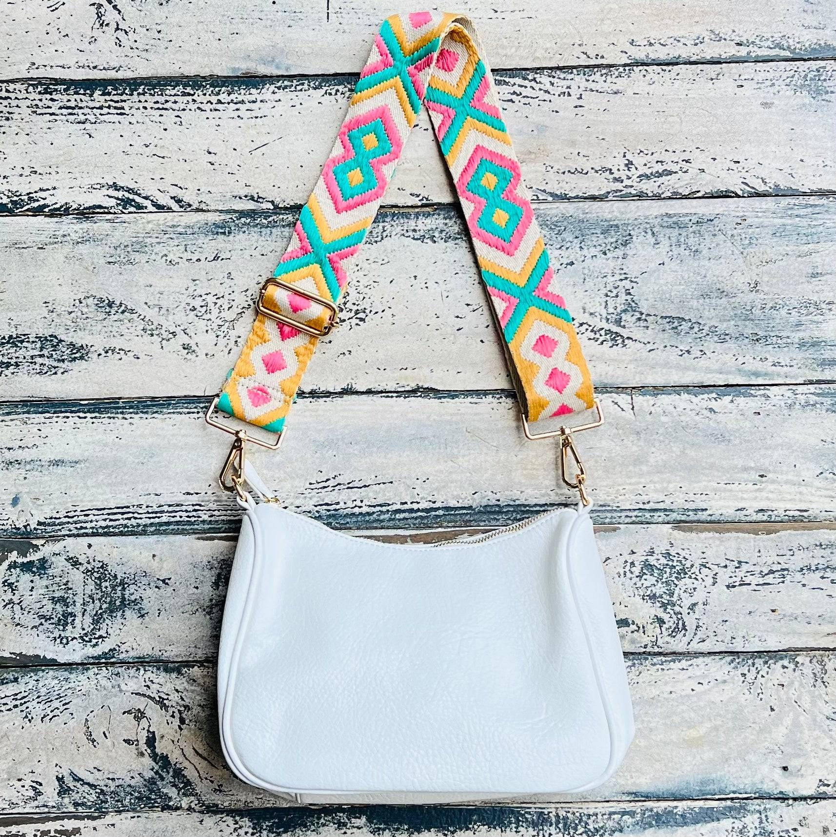 Start2Finish Lucy handbag with adjustable strap, showcasing its stylish leather design and versatile accessory features.