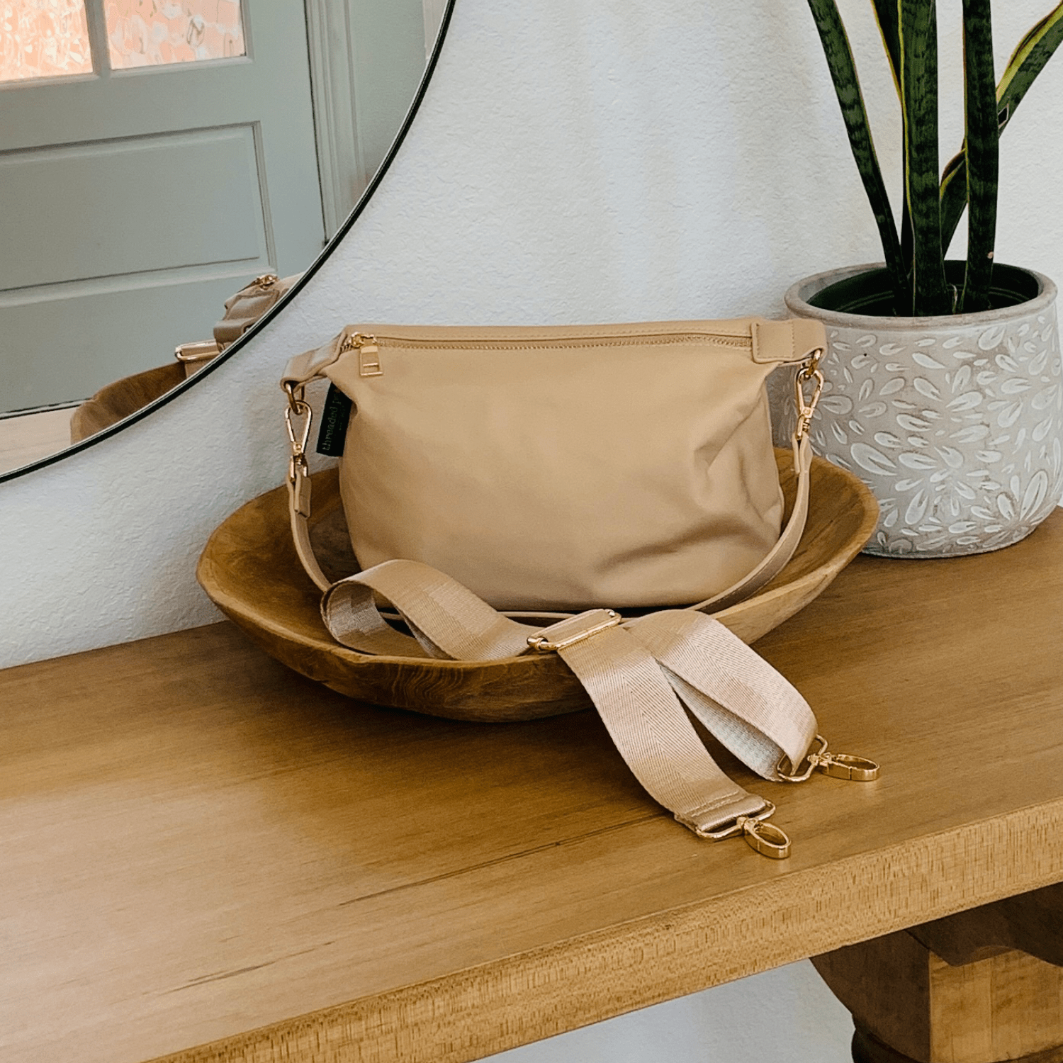 Start2Finish Everly Crossbody accessory bag with adjustable strap and multiple compartments, shown in black fabric.