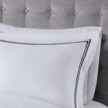 Start2Finish 100% cotton sateen embroidered duvet cover set shown in a cozy bedding arrangement with decorative pillows.