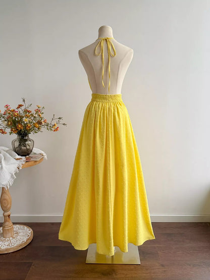 Pear Daisy Swiss Dot Halter Neck Dress for women, featuring a stylish halter design with delicate Swiss dot pattern.
