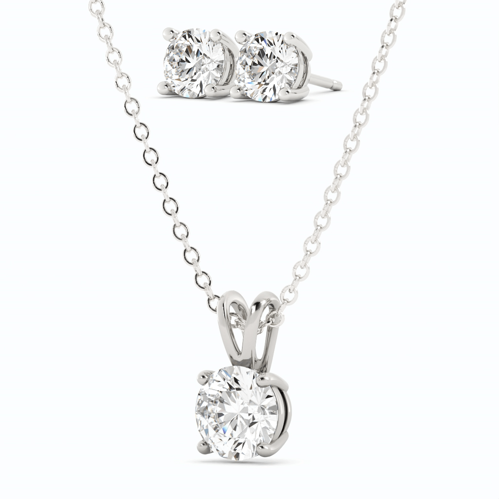Start2Finish 3-carat total weight moissanite stud earrings and pendant necklace set in 14K white gold overlay, featuring sparkling gemstone designs.