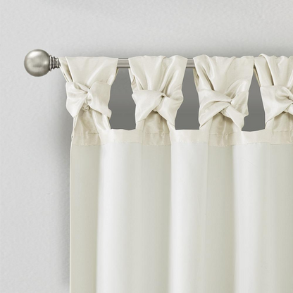 Pair of Start2Finish Twist Tab lined window curtain panels with a neutral fabric and modern design, hanging in a home setting.