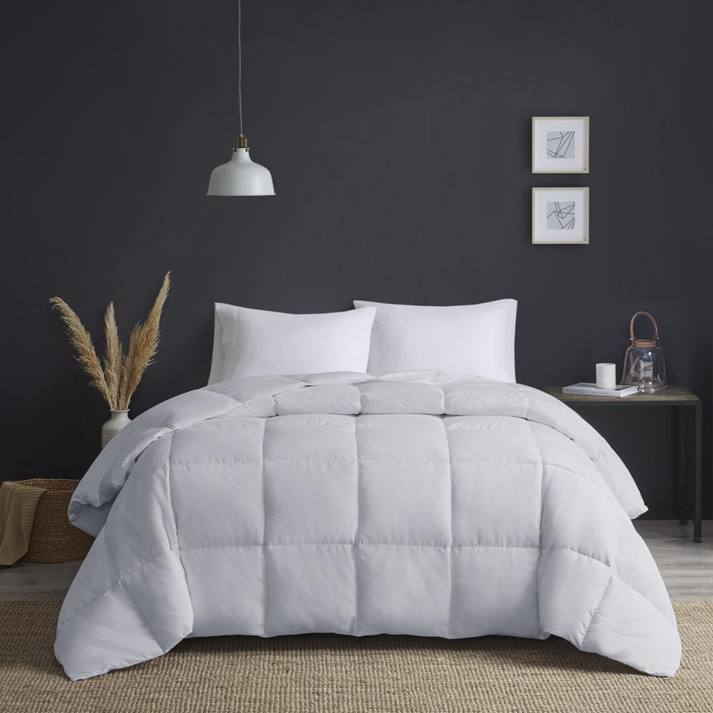 Large goose feather and down oversize comforter from Start2Finish showing soft, plush bedding with quilted stitching.