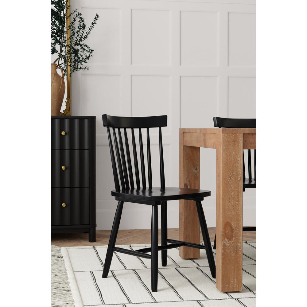 Set of two black Lyra side chairs by Start2Finish with sleek modern design and curved backrests, perfect for dining or living areas.