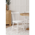 Set of 2 white Lyra side chairs by Start2Finish, featuring sleek modern furniture design with smooth, curved seats and wooden legs.