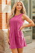 Solid corduroy sleeveless mini dress with front pockets by Byzantium Bay, featuring a fitted silhouette and stylish design.