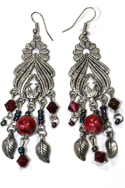 Silver Hestia Bohemian Queen Marbled Bead Earrings with gold accents and dangling bead details on a white background.