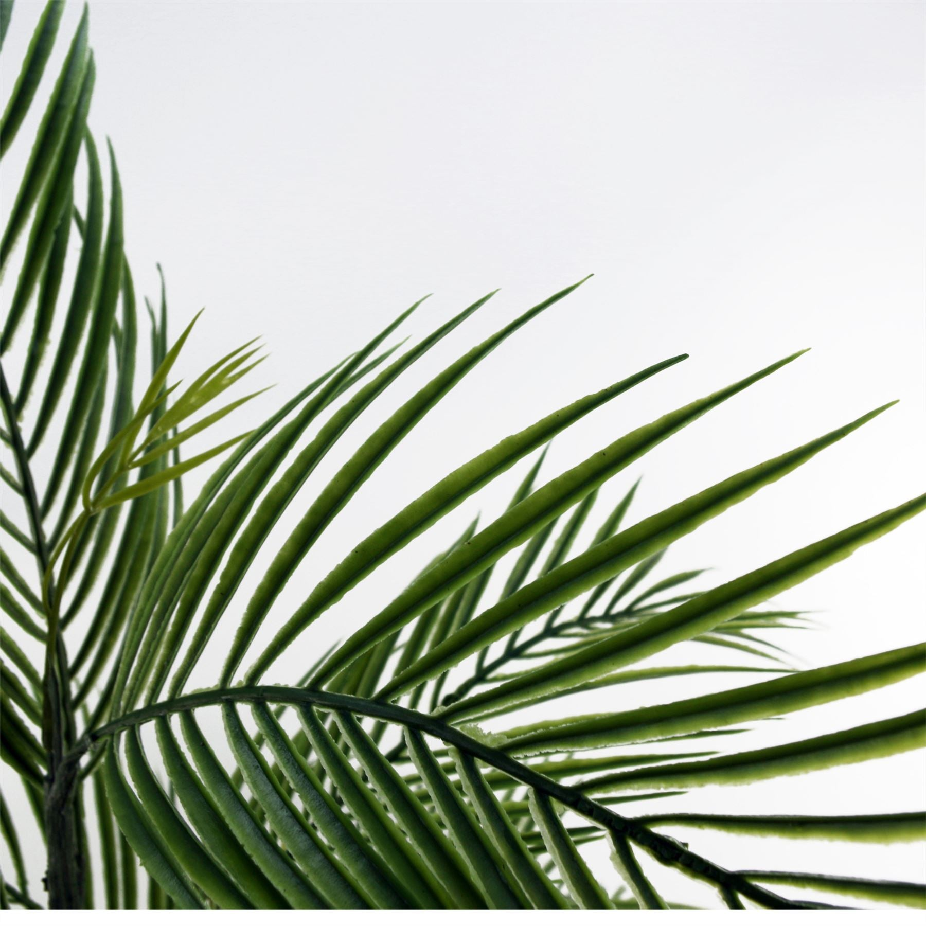 Artificial palm tree in a decorative planter, ideal for home or office decor by Start2Finish