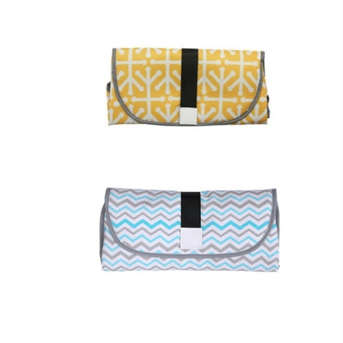 Soft, portable baby changing pad by CJDropshipping with cushioned surface and secure sides for easy diaper changes.