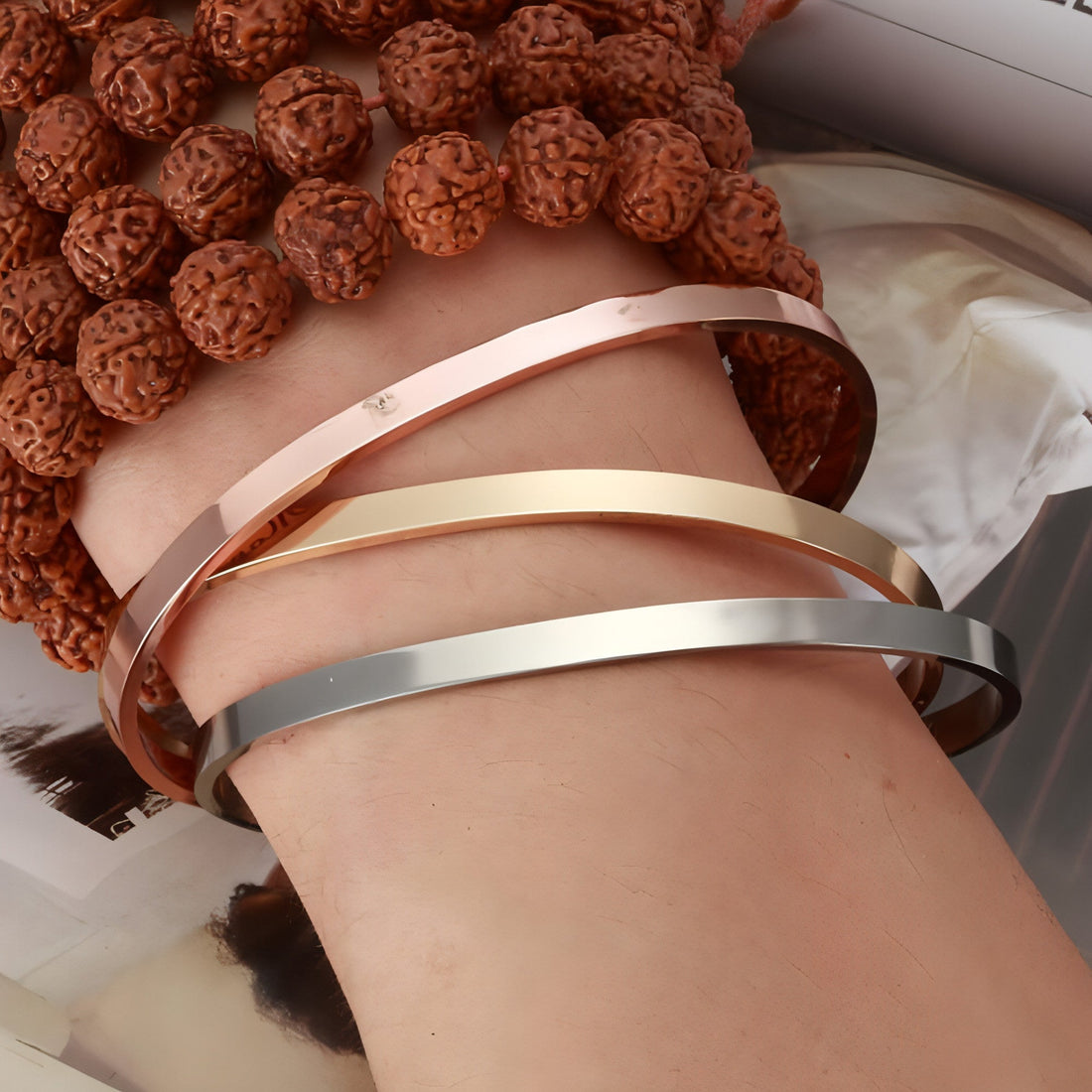 Personalized steel couple bracelet from Carmine Juneberry, sleek design for him and her with engraved details.