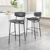 Set of two vintage black Charon barstools by Start2Finish with sleek metal frames and cushioned seats for stylish kitchen or bar area.