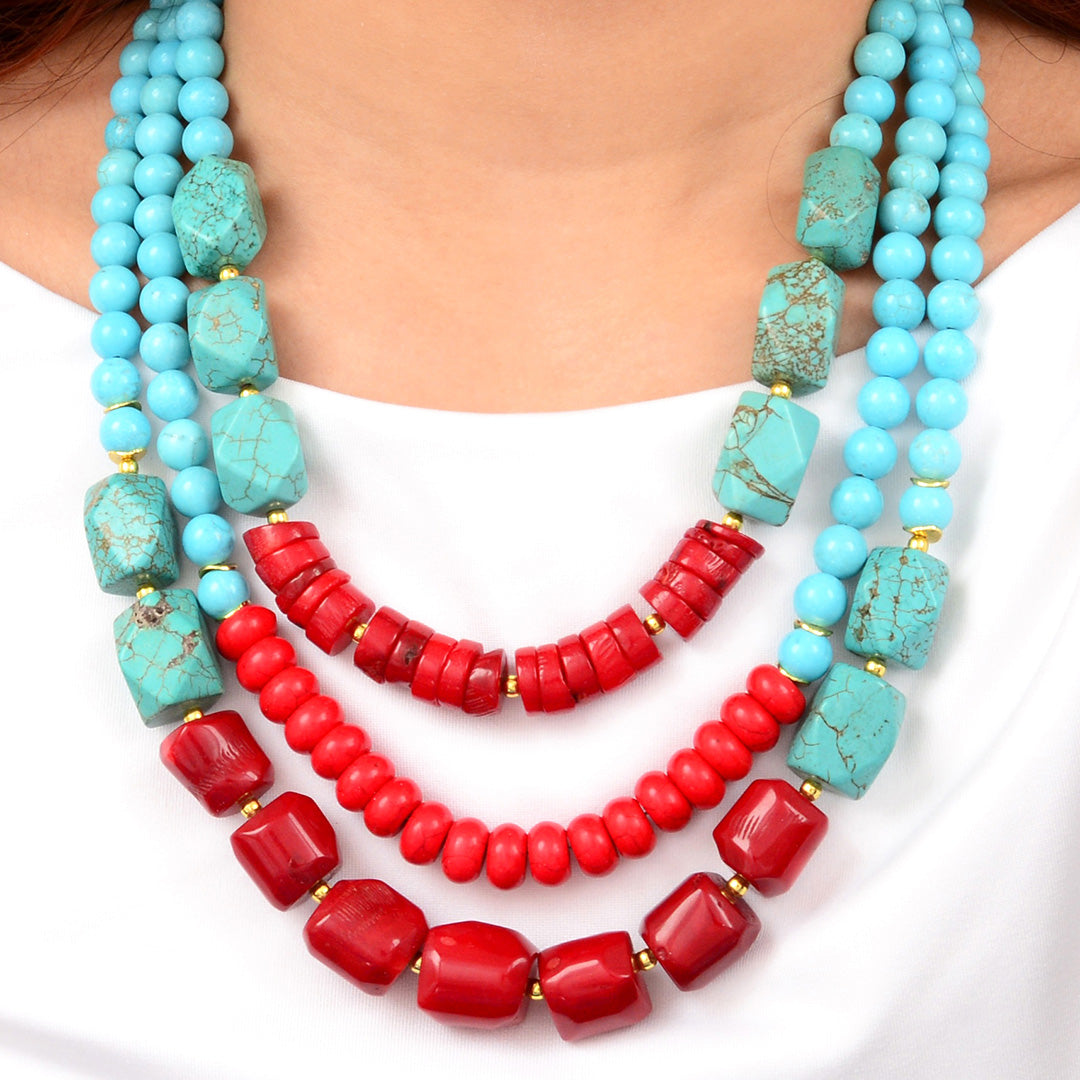 Start2Finish Guadalupe blue turquoise and red coral gold statement necklace with intricate jewelry design and bold colors.