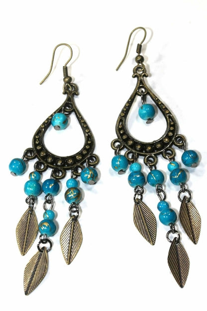 Silver Hestia Free Spirit Leaf Dangler Earrings featuring delicate leaf-shaped silver charms on ear hooks.