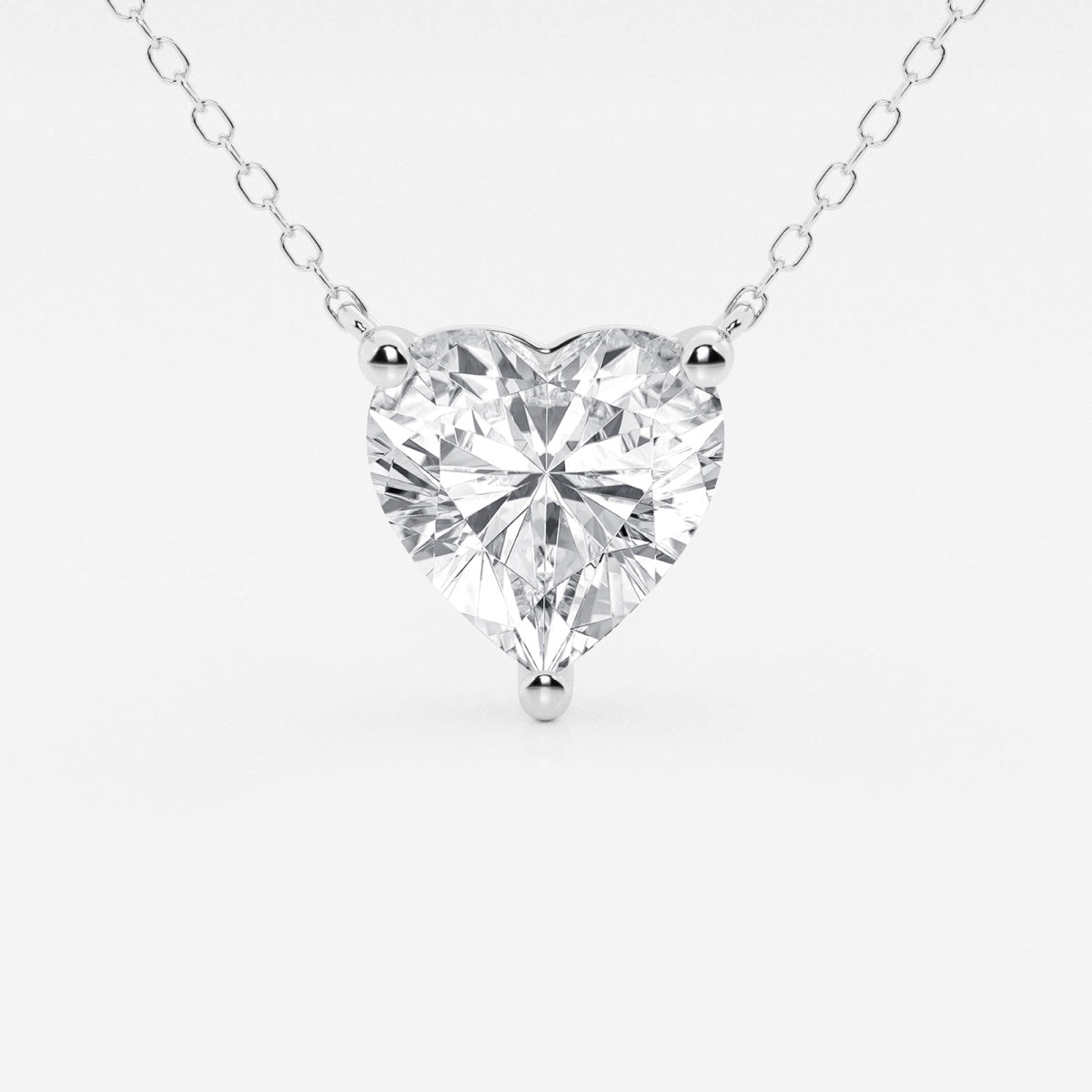 Floating heart-shaped lab-grown diamond pendant necklace in 14K gold, featuring a 2.00 CTW F/G VS1 diamond, AGI certified.